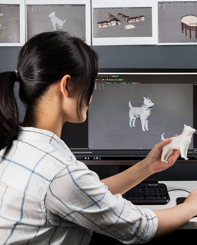 Person working with a 3D printed dog